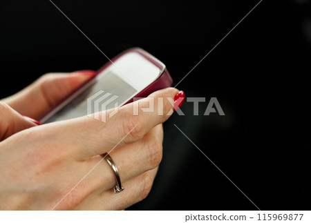 Businesswoman arm hold and use cellphone closeup 115969877
