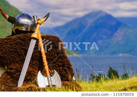 Viking helmet on fjord shore, Norway 115970059