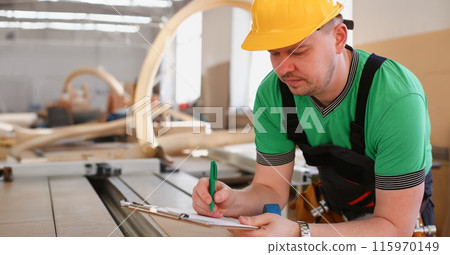 Portrait of young attractive man in work 115970149