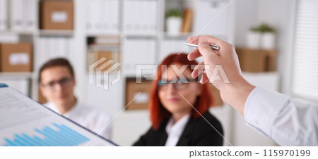 Male hands hold clipboard pad with statistics 115970199