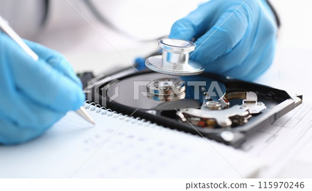 A male repairman wearing blue gloves 115970246