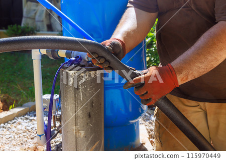 Before installing pipe, plumber applied thermal insulation isolation to water pvc pipe 115970449