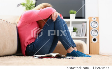 Unhappy lonely depressed woman sitting on the couch Unhappy lonely depressed woman sitting on the couch 115970453