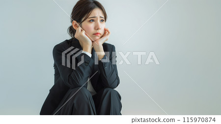 Depressed, worried business woman 115970874