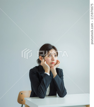 Depressed, worried business woman and office table Depressed, worried business woman and office table 115970875
