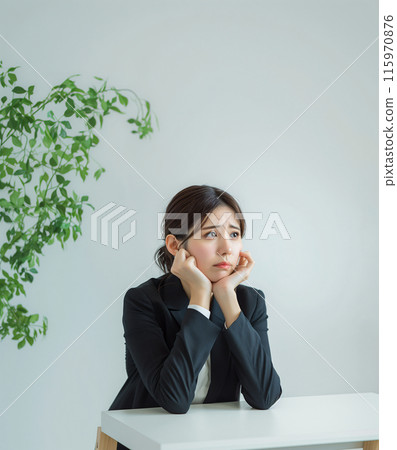 Depressed, worried business woman and office table 115970876