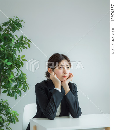 Depressed, worried business woman and office table 115970877