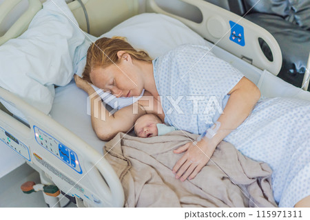 A baby lies with the mother after childbirth, resting peacefully. The serene moment captures the bond between mother and child as they begin their journey together. The hospital environment ensures a A baby lies with the mother after childbirth, resting peacefully. The serene moment captures the bond between mother and child as they begin their journey together. The hospital environment ensures a 115971311