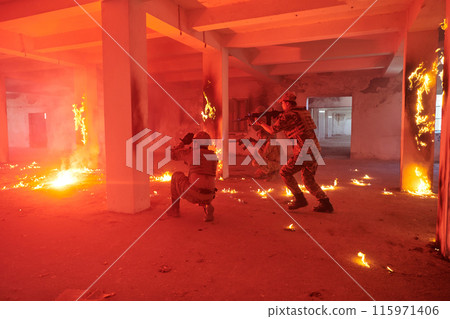 A group of professional soldiers bravely executes a dangerous rescue mission, surrounded by fire in a perilous building. A group of professional soldiers bravely executes a dangerous rescue mission, surrounded by fire in a perilous building. 115971406