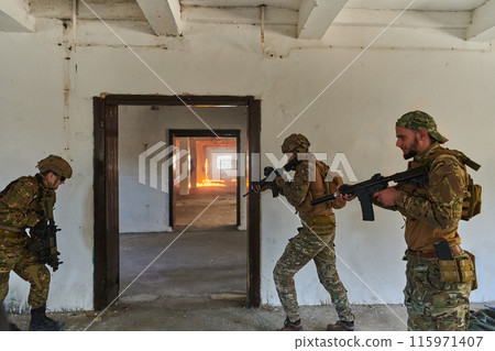 A group of professional soldiers bravely executes a dangerous rescue mission, surrounded by fire in a perilous building. 115971407