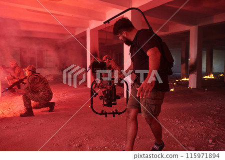 A professional cameraman captures the intense moments as a group of skilled soldiers embarks on a dangerous mission inside an abandoned building, their actions filled with suspense and bravery 115971894