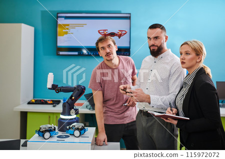 A group of students working together in a laboratory, dedicated to exploring the aerodynamic capabilities of a drone 115972072