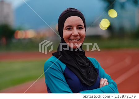 A Muslim woman with a burqa, an Islamic sportswoman resting after a vigorous training session on the marathon course. A hijab woman is preparing for a marathon competition A Muslim woman with a burqa, an Islamic sportswoman resting after a vigorous training session on the marathon course. A hijab woman is preparing for a marathon competition 115972179