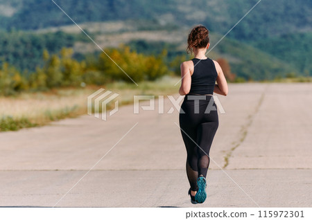 Unstoppable: A Determined Athlete Trains Through the Rain in Pursuit of Marathon Glory 115972301