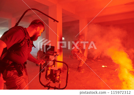 A professional cameraman captures the intense moments as a group of skilled soldiers embarks on a dangerous mission inside an abandoned building, their actions filled with suspense and bravery 115972312
