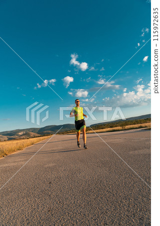 Triathlete in professional gear running early in the morning, preparing for a marathon, dedication to sport and readiness to take on the challenges of a marathon.  115972635