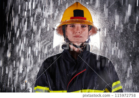 A determined female firefighter in a professional uniform striding through the dangerous, rainy night on a daring rescue mission, showcasing her unwavering bravery and commitment to saving lives. A determined female firefighter in a professional uniform striding through the dangerous, rainy night on a daring rescue mission, showcasing her unwavering bravery and commitment to saving lives. 115972758