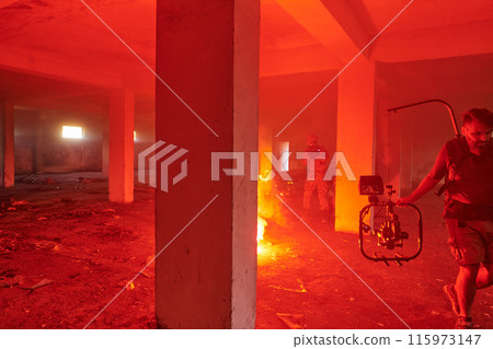 A professional cameraman captures the intense moments as a group of skilled soldiers embarks on a dangerous mission inside an abandoned building, their actions filled with suspense and bravery 115973147