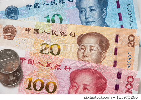 Many of different Chinese yuan banknotes. Chinese paper currency Yuan renminbi banknotes and coins as background. 115973260