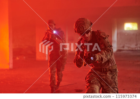 A group of professional soldiers bravely executes a dangerous rescue mission, surrounded by fire in a perilous building. A group of professional soldiers bravely executes a dangerous rescue mission, surrounded by fire in a perilous building. 115973374