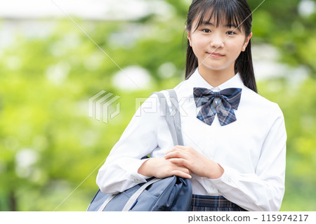 School girls with school bags 115974217