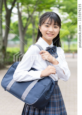 School girls with school bags 115974235