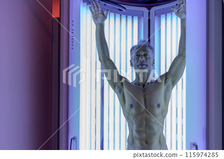 Tanning salon senior man Tanning salon senior man 115974285