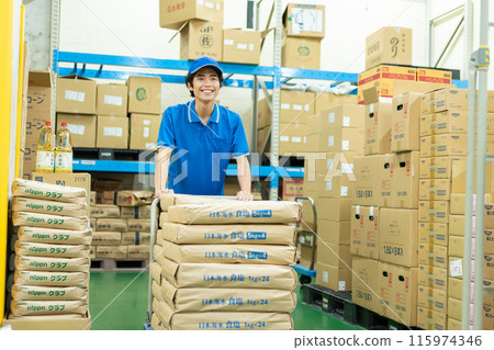 Young male driver working in warehouse Young male driver working in warehouse 115974346