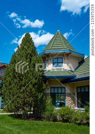 Beautiful picturesque old houses in the Canadian town of Canmore in the mountains Beautiful picturesque old houses in the Canadian town of Canmore in the mountains 115975359
