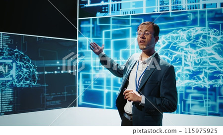Smiling public speaker hosting AI convention gathering tech startups managers and academics. IT expert moderating symposium, teaching industry workers how to tap into artificial intelligence, camera B 115975925