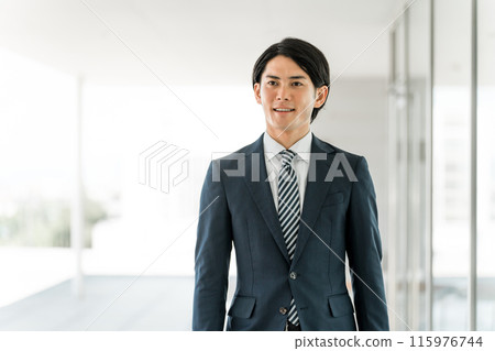 Young male Asian businessman going to work/office/commuting to work/office 115976744