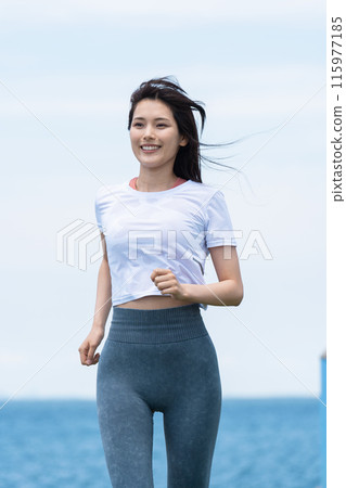 Young woman jogging on the seaside Young woman jogging on the seaside 115977185