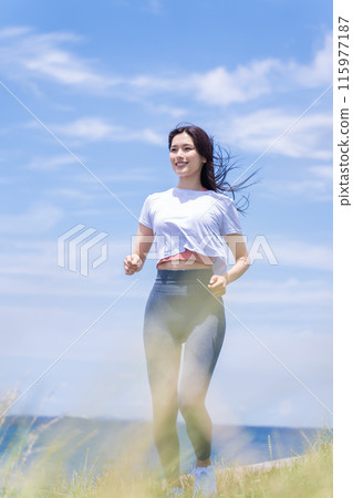 Young woman jogging on the seaside 115977187