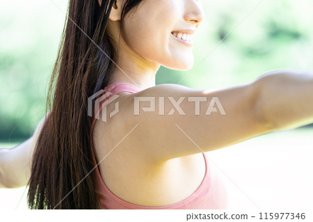 Woman doing yoga in green park (outdoor portrait, relaxing) Woman doing yoga in green park (outdoor portrait, relaxing) 115977346