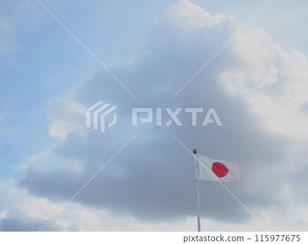 The Japanese flag fluttering in the wind, sky and clouds (with space) The Japanese flag fluttering in the wind, sky and clouds (with space) 115977675