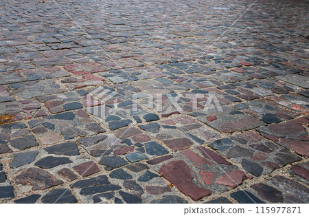 Abstract background of old cobblestone pavement close-up. Abstract background of old cobblestone pavement close-up. 115977871