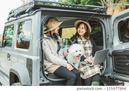 Women, friends, best friends in outdoor fashion driving with their pet dog Women, friends, best friends in outdoor fashion driving with their pet dog 115977984