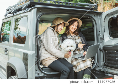 Women, friends, best friends in outdoor fashion driving with their pet dog Women, friends, best friends in outdoor fashion driving with their pet dog 115977986
