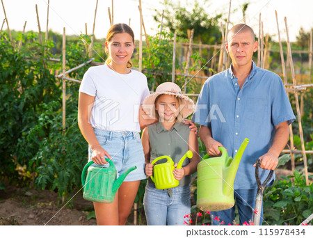 Family in kitchen garden 115978434