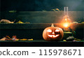 Halloween Pumpkin Jack-O-Lantern and a kerosene lamp on the porch of a house protects against evil spirits 115978671