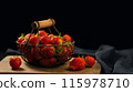 Fresh ripe strawberries in a metal basket on the table 115978710