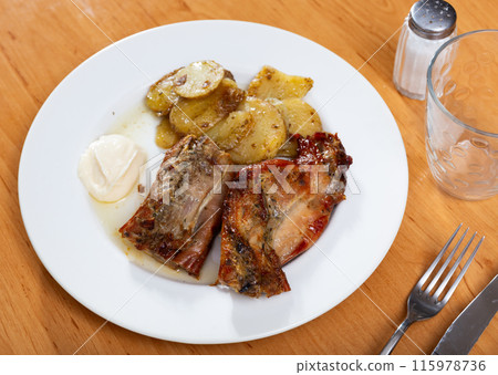 Appetizing stew with rabbit and potatoes. Healthy hearty dinner Appetizing stew with rabbit and potatoes. Healthy hearty dinner 115978736