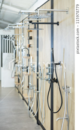 Modern showerheads and bathroom fixtures on display in home improvement store Modern showerheads and bathroom fixtures on display in home improvement store 115978779