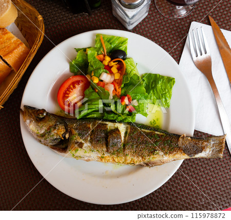 Grilled seabass accompanied by colorful fresh vegetable salad Grilled seabass accompanied by colorful fresh vegetable salad 115978872