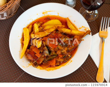 Lunch is served on plate - pieces of young rabbit with vegetable ragout samfain sauce Lunch is served on plate - pieces of young rabbit with vegetable ragout samfain sauce 115978914