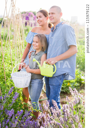 Family in kitchen garden 115979122