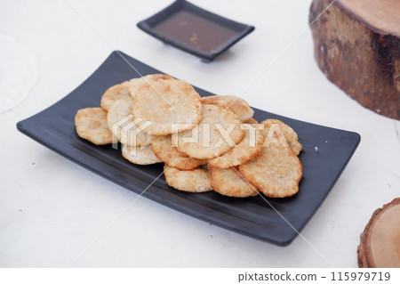 french fries in round slices as a background 115979719