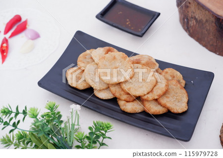 french fries in round slices as a background 115979728