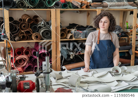 Woman tanner at work in the workshop.  115980546