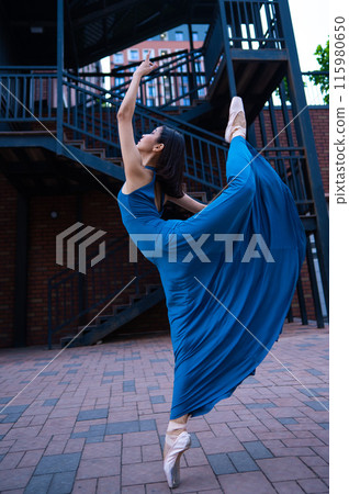 Beautiful Asian ballerina dancing outdoors. Urban landscape. Beautiful Asian ballerina dancing outdoors. Urban landscape. 115980650
